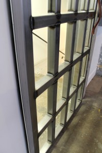 Custom steel tube door with glass inserts